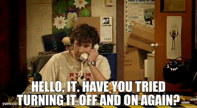 a man picking up the phone & instantly saying "Hello, IT. Have you tried turning it off & on again?"